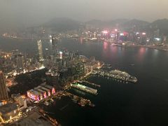 09B Looking down on Kowloon with Victoria Harbour and Hong Kong beyond after sunset from The Ozone rooftop bar Ritz-Carlton Hong Kong
